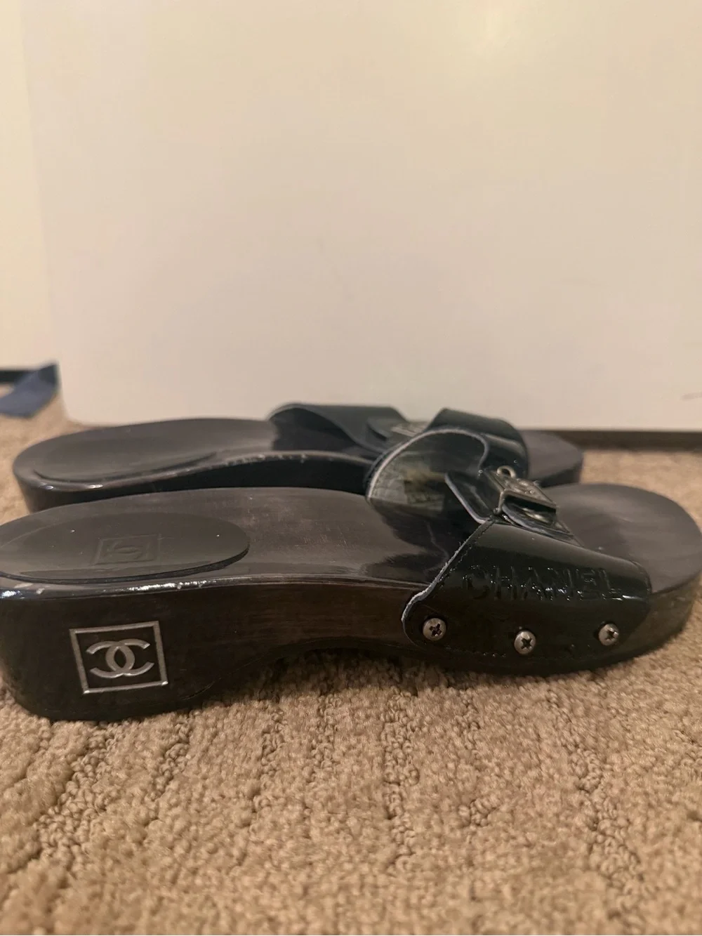 CHANEL Black Patent Leather Slide Mules with Silver Logo Plaque